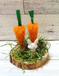 Bunny with trees or carrots on wood round